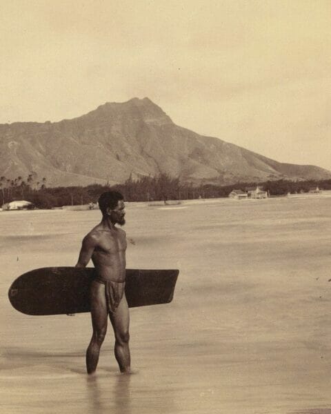 Wooden surfboards making a comeback. First photographed image of a surfer in Hawaii in 1890